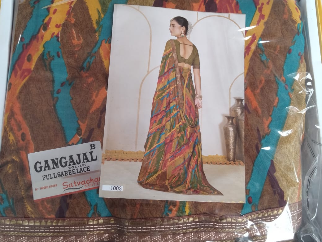 A packaged Gangajal full saree lace by Satvacha, featuring a colorful abstract pattern in brown, teal, orange, and gold. A central printed card shows a model wearing a saree made from the fabric, and a white label on the lower left reads 'GANGAJAL FULL SAREE LACE' with the Satvacha brand.